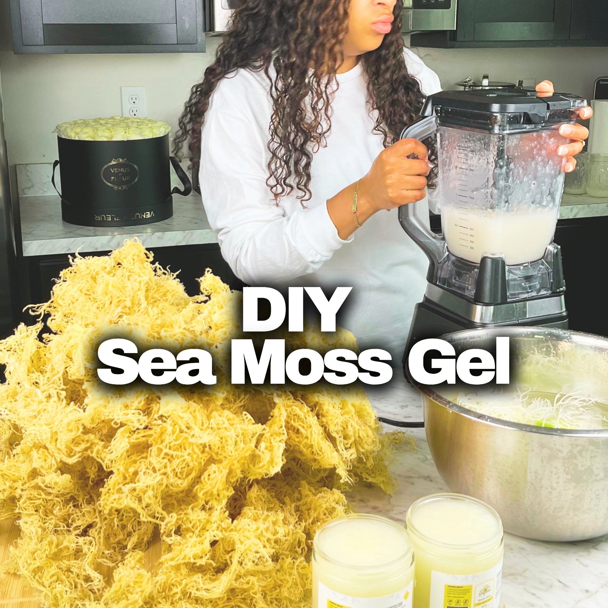 Raw gold sea moss being prepared into gel at home. A bowl of sea moss soaking in water, a blender, finished sea moss gel in glass jars, and dried sea moss on the counter.