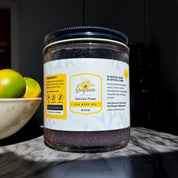 Sunflower Wellness full spectrum sea moss gel on kitchen counter with limes