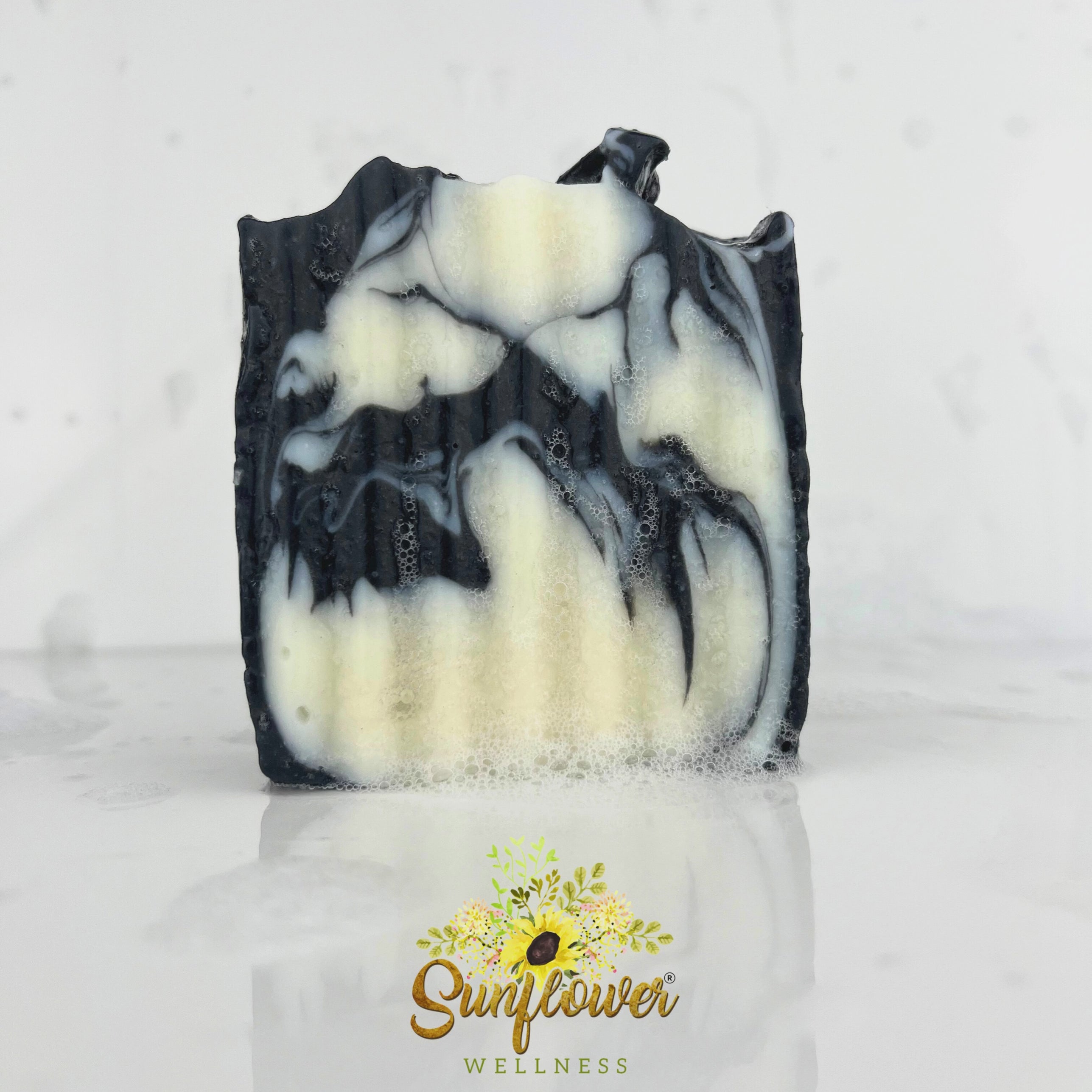Handcrafted sea moss soap bar with activated charcoal, lathering richly with water. Natural, vegan, and detoxifying — ideal for face and body care.