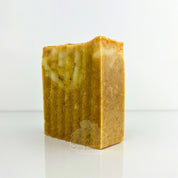 Natural turmeric and sea moss soap bar by Sunflower Wellness, handmade for glowing, mineral-rich skin care.