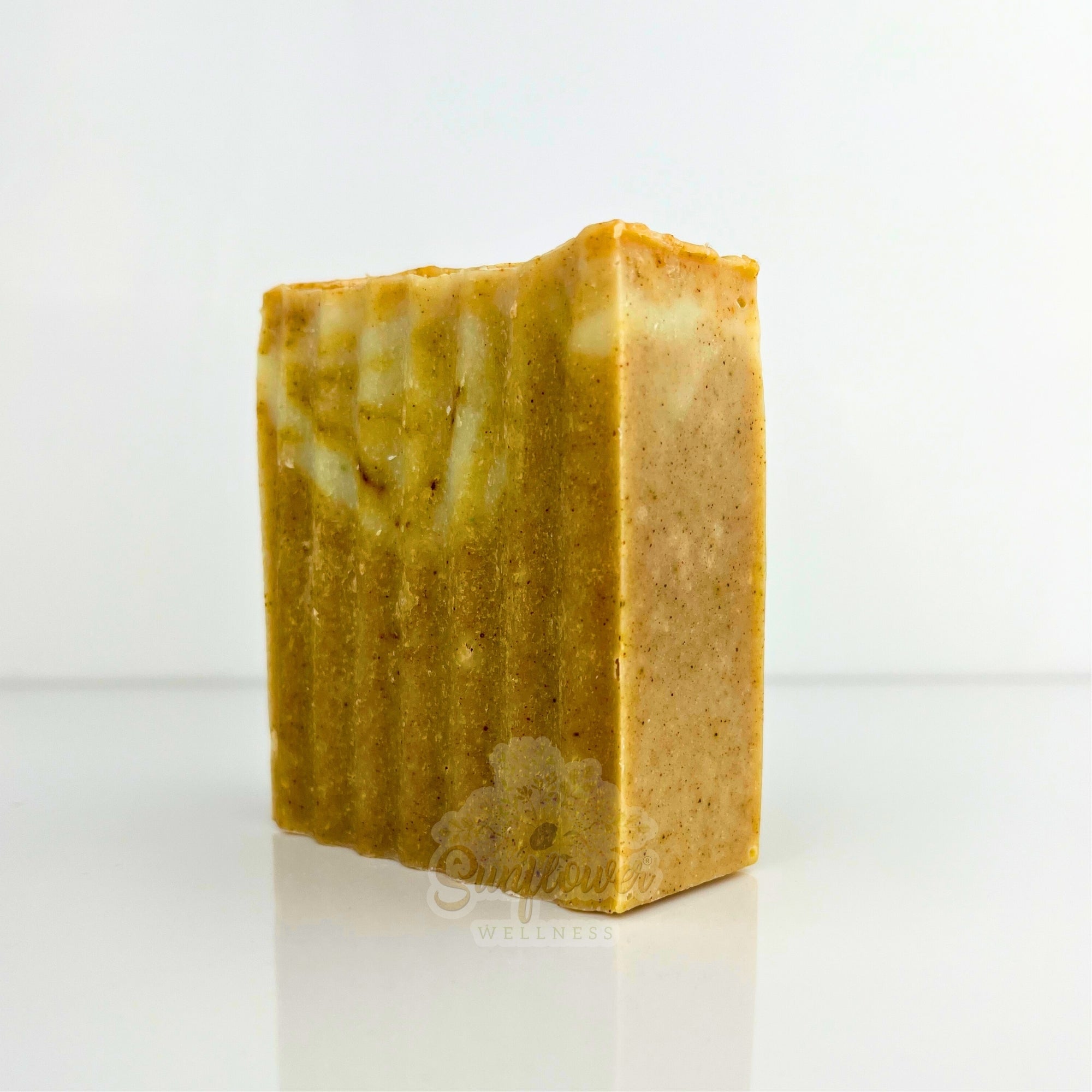 Natural turmeric and sea moss soap bar by Sunflower Wellness, handmade for glowing, mineral-rich skin care.
