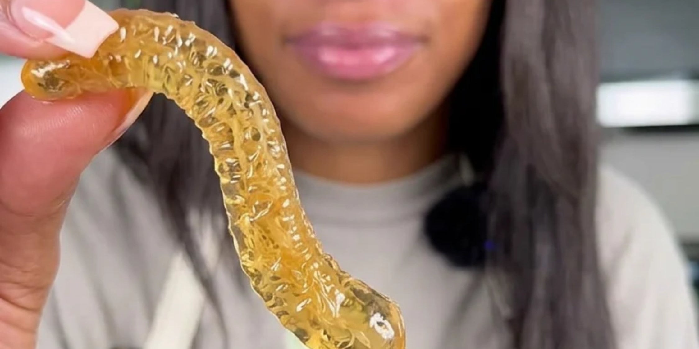 woman with sea moss gummy worm