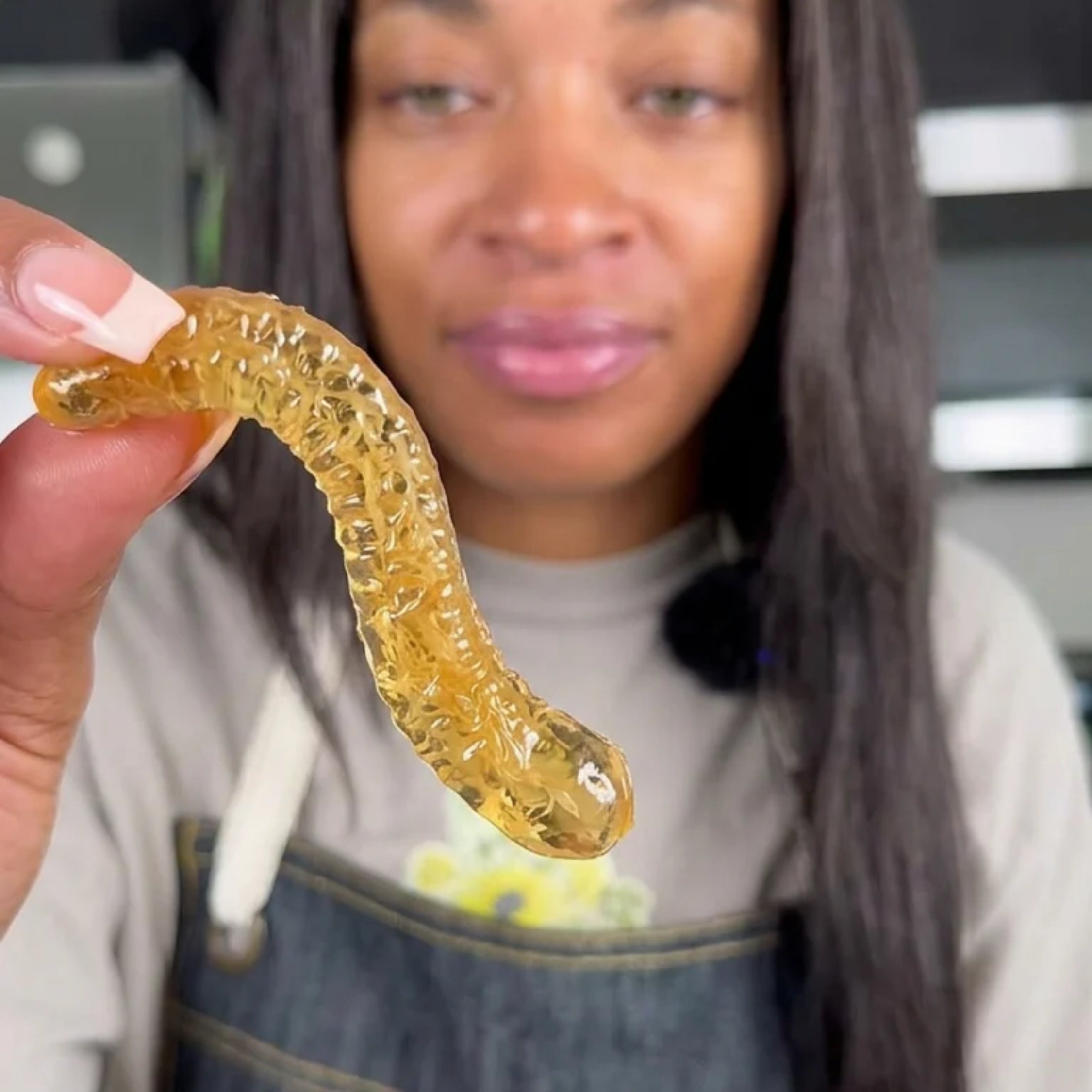 woman with sea moss gummy worm