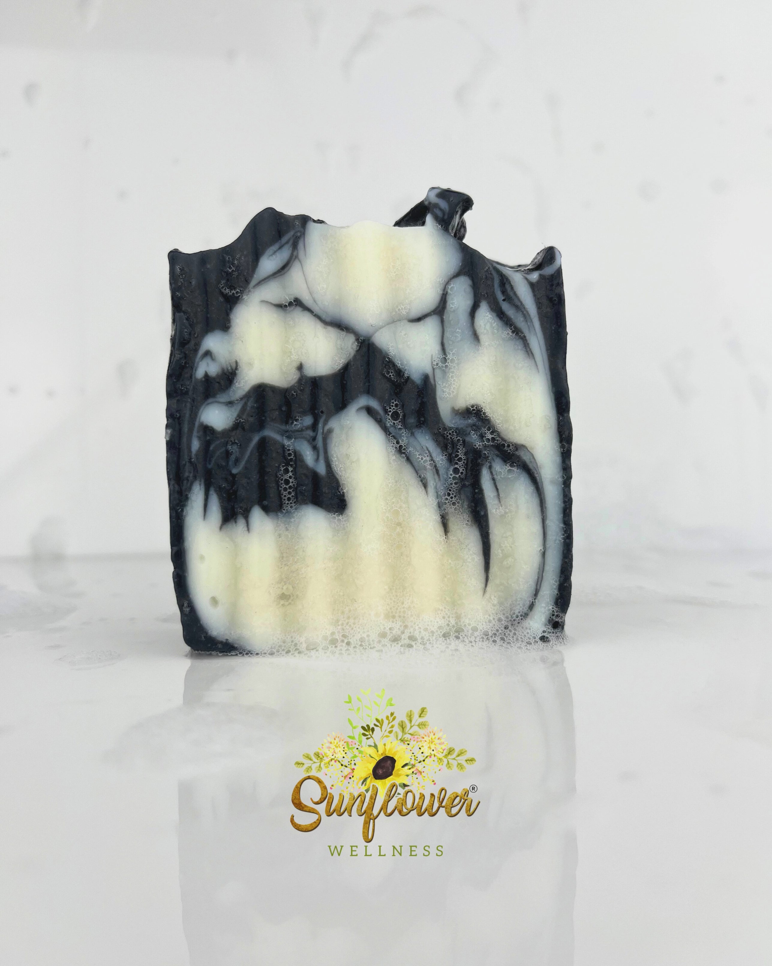 Handcrafted sea moss soap bar with activated charcoal, lathering richly with water. Natural, vegan, and detoxifying — ideal for face and body care.