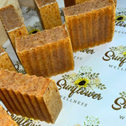 Handcrafted bars of Turmeric Sea Moss Soap with a rich golden hue, made with wildcrafted St. Lucia sea moss, turmeric, and nourishing plant-based oils. Perfect for sensitive skin and fragrance-free cleansing.